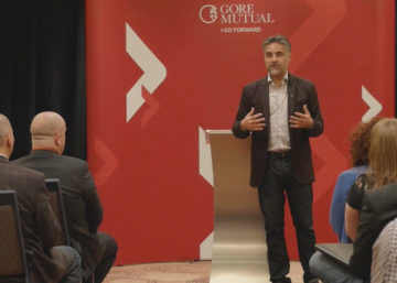 Picture of Bruce Croxon presenting at GoreMutual meeting