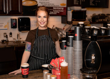 Picture of Chelsea Fitzpatrick smiling at cafe